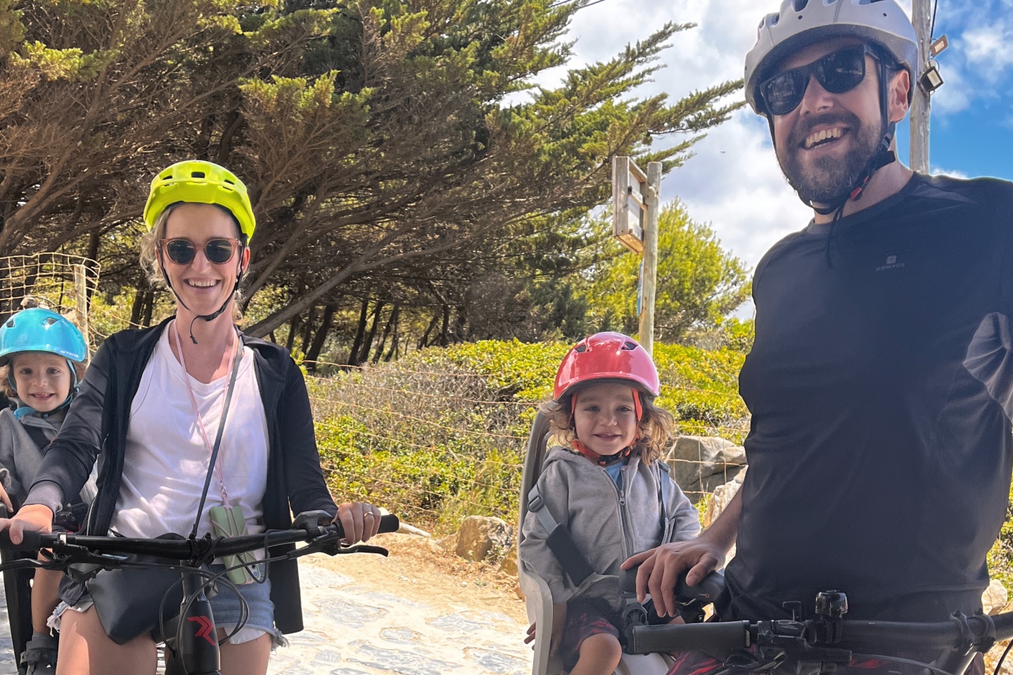 Cyclists exploring Cascais landmarks along the coast — Santa Marta lighthouse, Guincho beach and old town