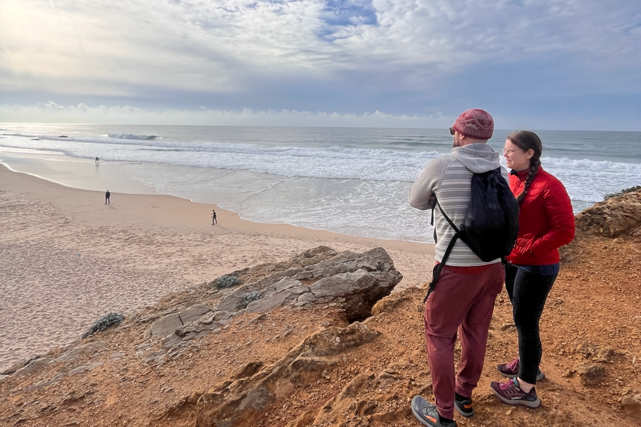 Cyclists exploring Cascais landmarks along the coast — Santa Marta lighthouse, Guincho beach and old town