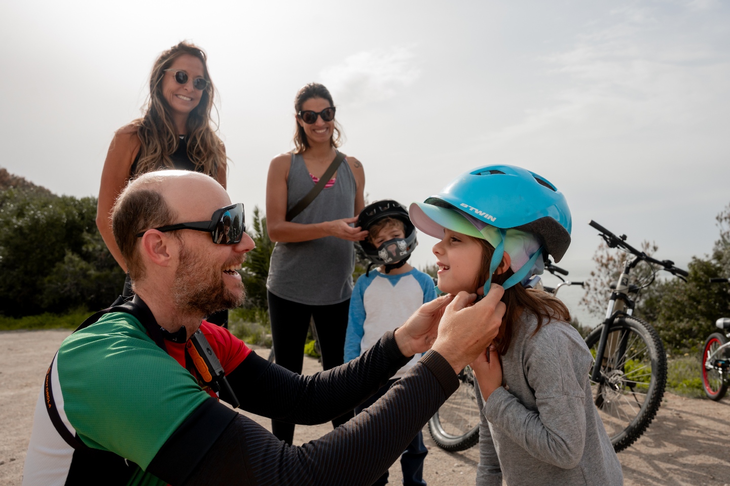 Cyclists exploring Cascais landmarks along the coast — Santa Marta lighthouse, Guincho beach and old town