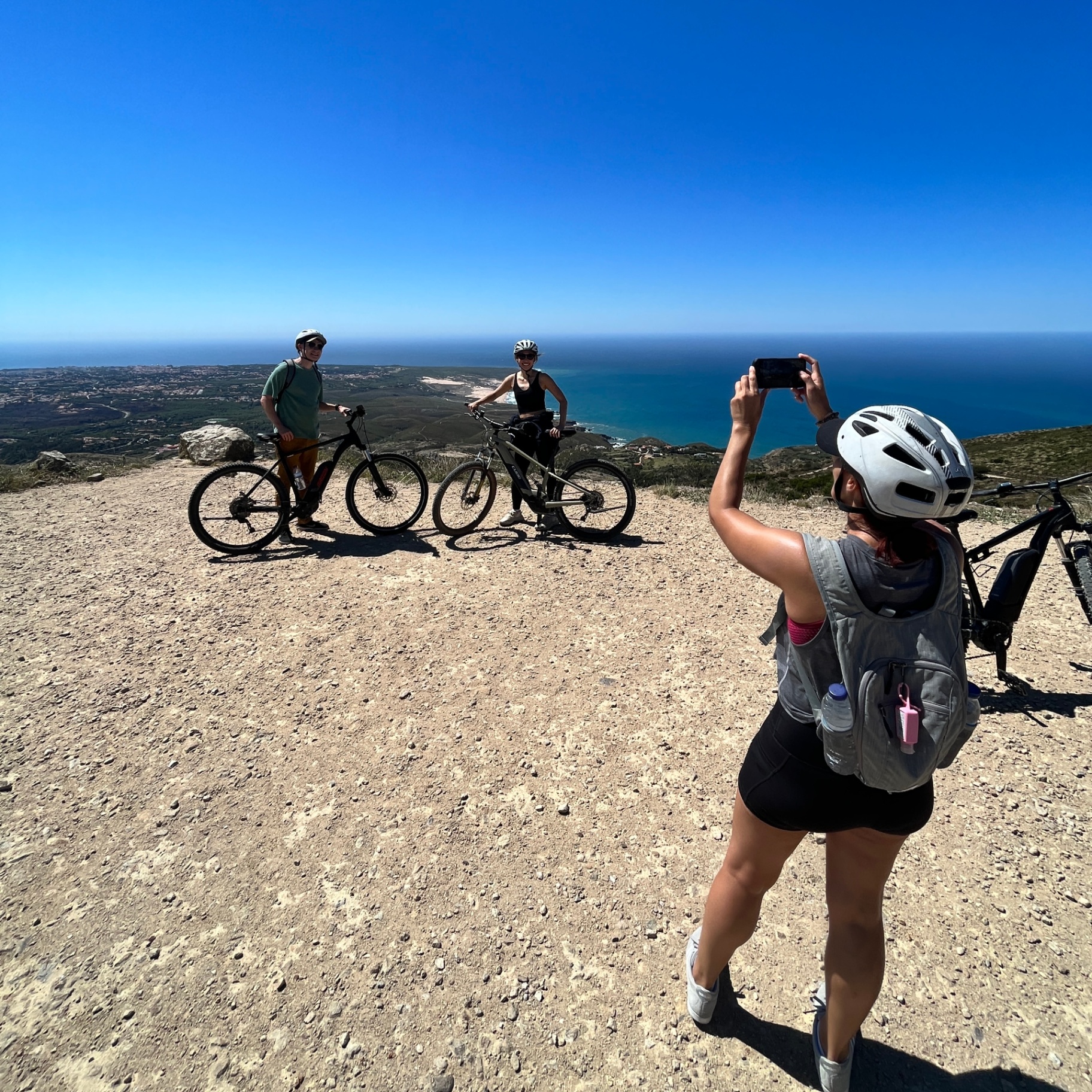 Rider on a Sintra-Cascais hilltop trail overlooking the Atlantic coast